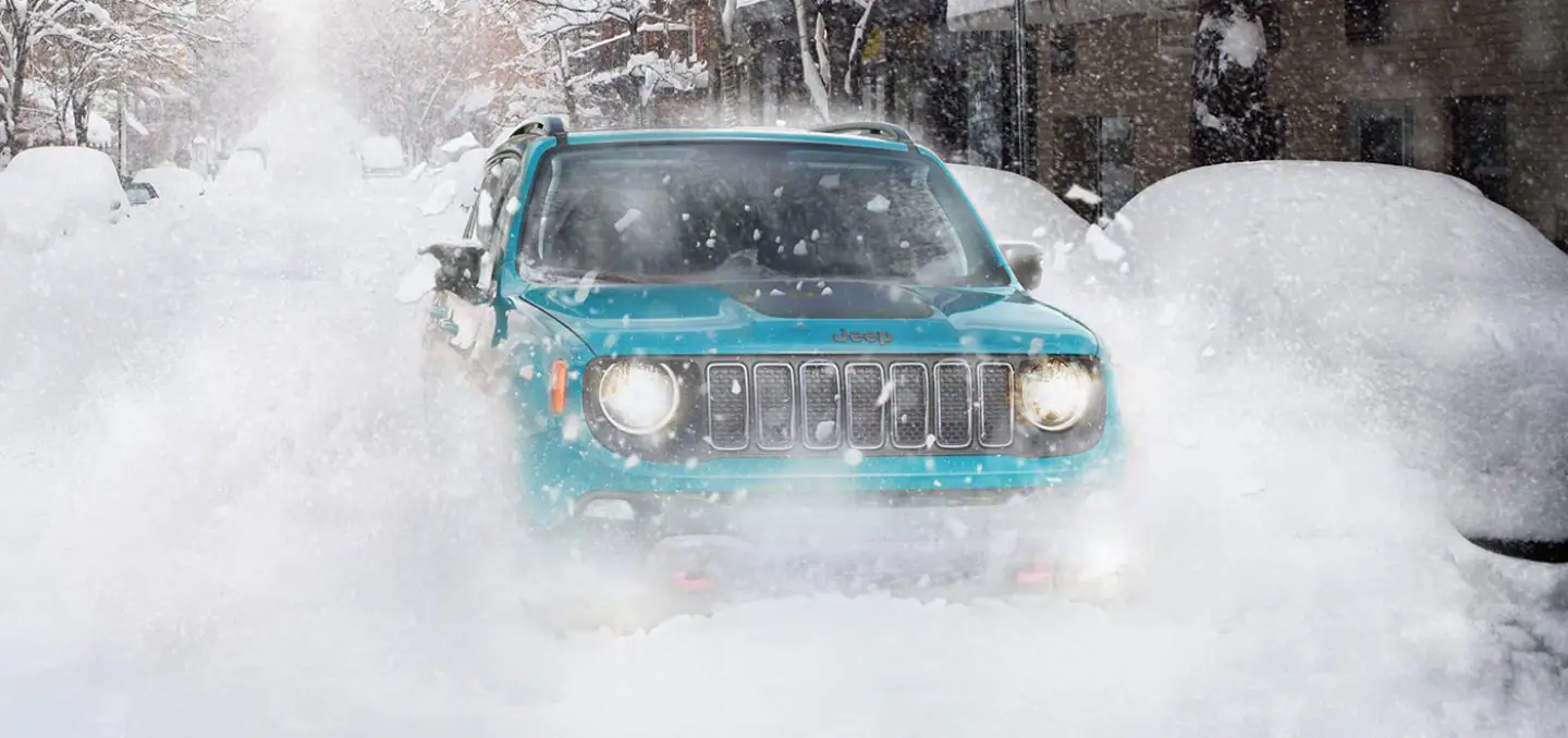New Jeep Renegade Driving on The Heavy Snow During Winter