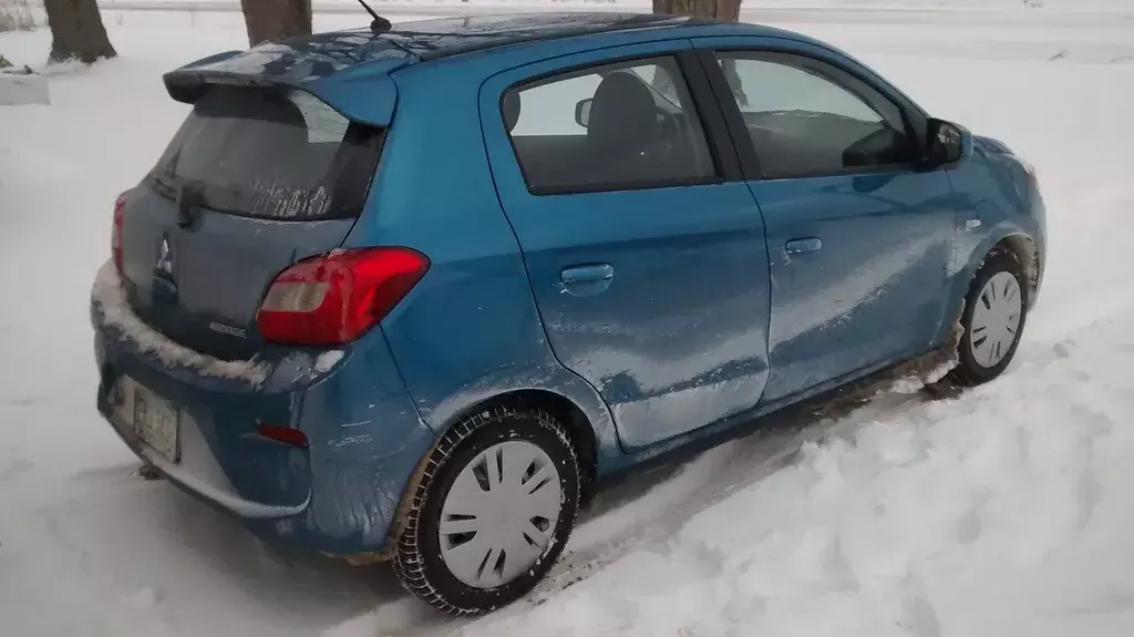 Mitsubishi Mirage in Snowy Road