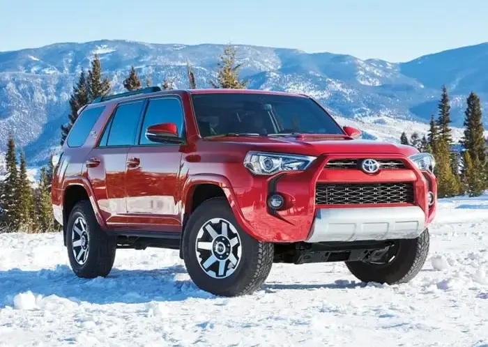 Red Toyota 4Runner in Snow